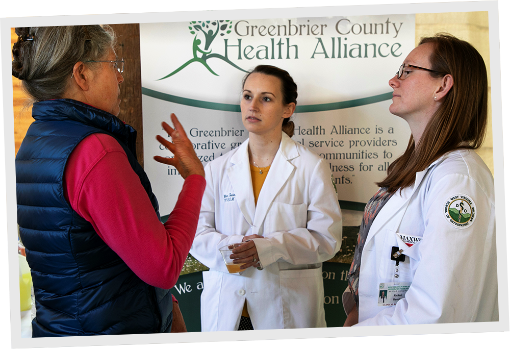 Group of Greenbrier health alliance doctors talking.