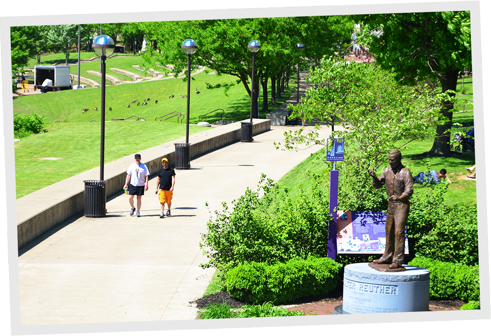 Wheeling: two men walking along a pathway.